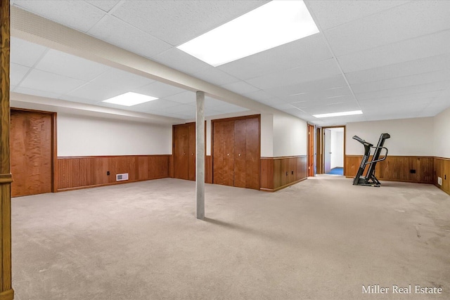 4700 M-79, Nashville, MI 49073 - finished basement with wainscoting, a drop ceiling, carpet floors, and wood walls