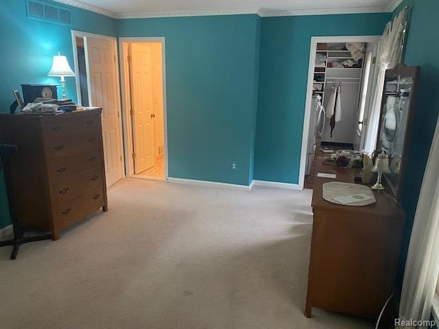 28532 Perryville Way, Farmington Hills, MI 48331 - bedroom with ornamental molding, a closet, carpet floors, and washer / dryer