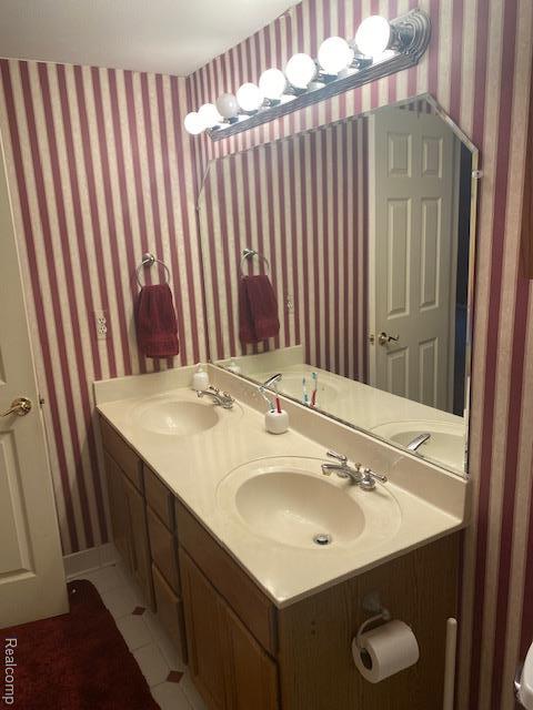 28532 Perryville Way, Farmington Hills, MI 48331 - bathroom featuring tile patterned floors, wallpapered walls, and double vanity