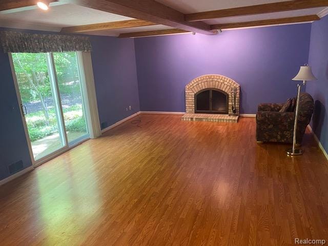 28532 Perryville Way, Farmington Hills, MI 48331 - unfurnished living room featuring a brick fireplace, beam ceiling, and wood finished floors