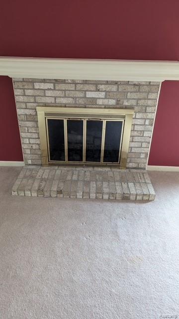 28532 Perryville Way, Farmington Hills, MI 48331 - detailed view of a brick fireplace and carpet floors