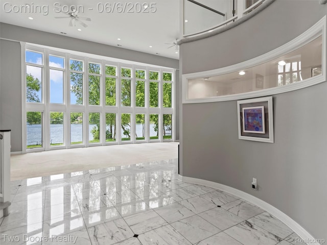532 Shrewsbury Dr, Clarkston, MI 48348 - interior space with a water view, baseboards, marble finish floors, and recessed lighting