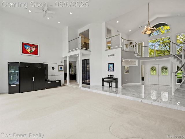 532 Shrewsbury Dr, Clarkston, MI 48348 - living room with stairs, high vaulted ceiling, marble tiled flooring, a ceiling fan, and a chandelier