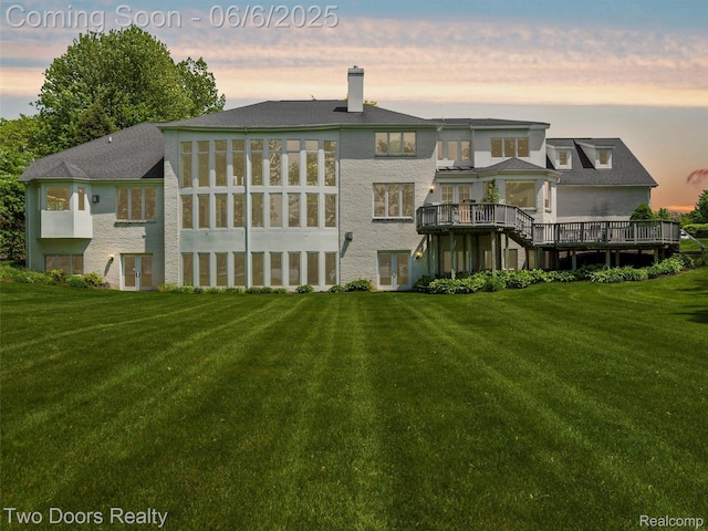 532 Shrewsbury Dr, Clarkston, MI 48348 - back of house at dusk featuring french doors, a yard, a chimney, and a deck