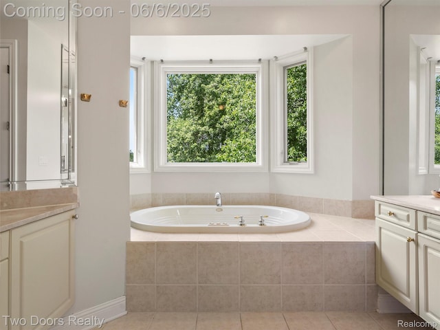 532 Shrewsbury Dr, Clarkston, MI 48348 - bathroom featuring vanity, a garden tub, and tile patterned floors