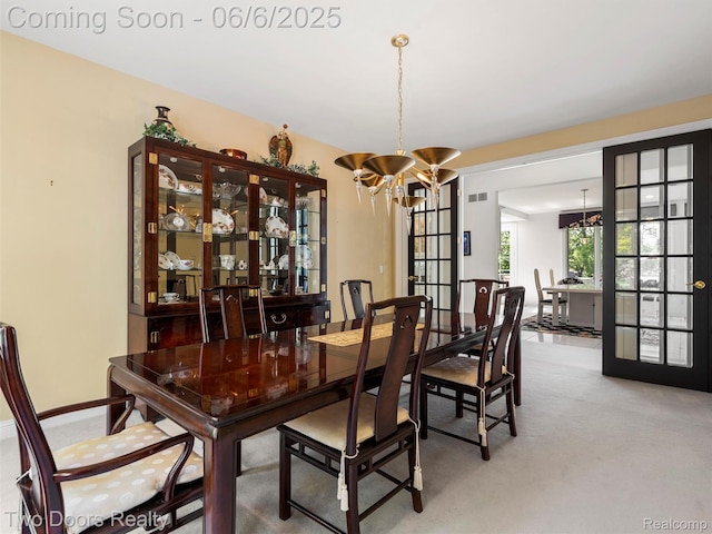 532 Shrewsbury Dr, Clarkston, MI 48348 - dining room featuring a chandelier, light colored carpet, and french doors