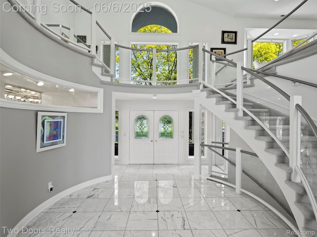 532 Shrewsbury Dr, Clarkston, MI 48348 - entryway with a high ceiling, marble tiled flooring, baseboards, and stairs