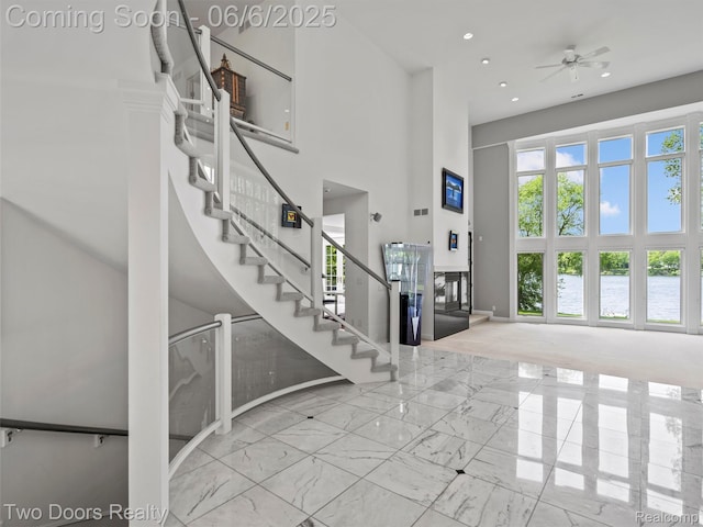 532 Shrewsbury Dr, Clarkston, MI 48348 - foyer with a high ceiling, marble finish flooring, baseboards, stairs, and a ceiling fan