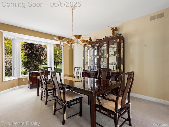 532 Shrewsbury Dr, Clarkston, MI 48348 - dining space featuring a chandelier, baseboards, and light colored carpet