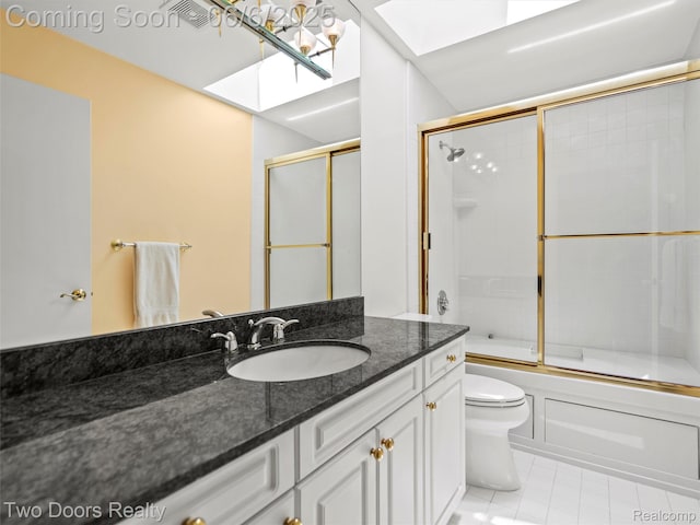 532 Shrewsbury Dr, Clarkston, MI 48348 - full bath with a skylight, toilet, vanity, bath / shower combo with glass door, and tile patterned floors