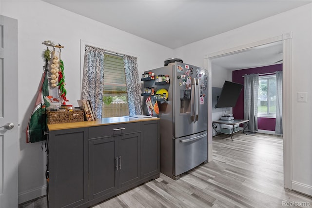13902 Toepfer Rd, Warren, MI 48089 - kitchen with stainless steel fridge with ice dispenser, light wood-style floors, baseboards, and gray cabinetry