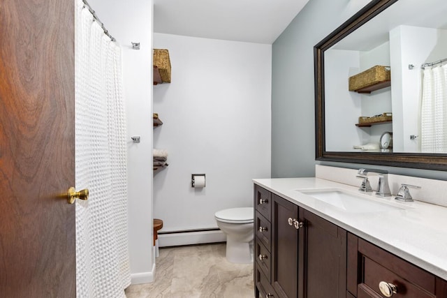 2294 Pinewood St, Jenison, MI 49428 - full bath with a baseboard heating unit, toilet, vanity, marble look tile flooring, and baseboards