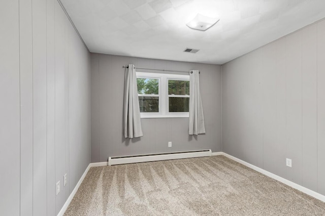 2294 Pinewood St, Jenison, MI 49428 - carpeted spare room featuring baseboard heating and baseboards