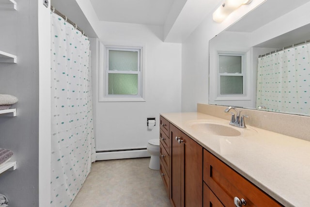 2294 Pinewood St, Jenison, MI 49428 - full bath with a baseboard radiator, vanity, toilet, tile patterned floors, and a shower with shower curtain