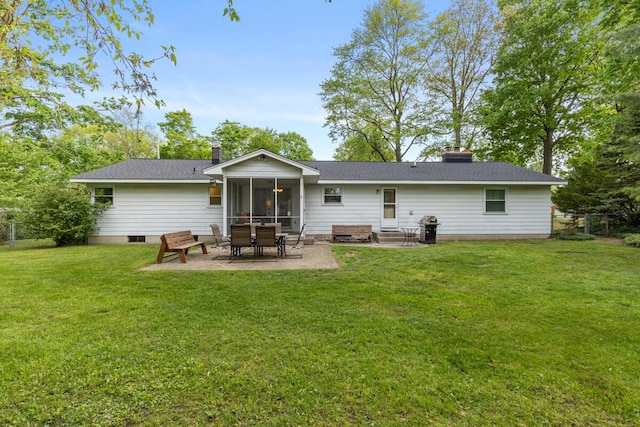 2294 Pinewood St, Jenison, MI 49428 - back of house featuring a chimney, a patio area, a lawn, and a sunroom