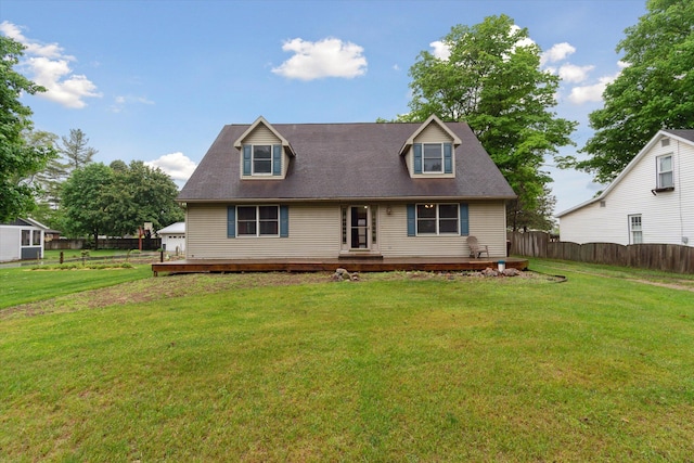123 N F St, Trufant, MI 49347 - cape cod house with a wooden deck