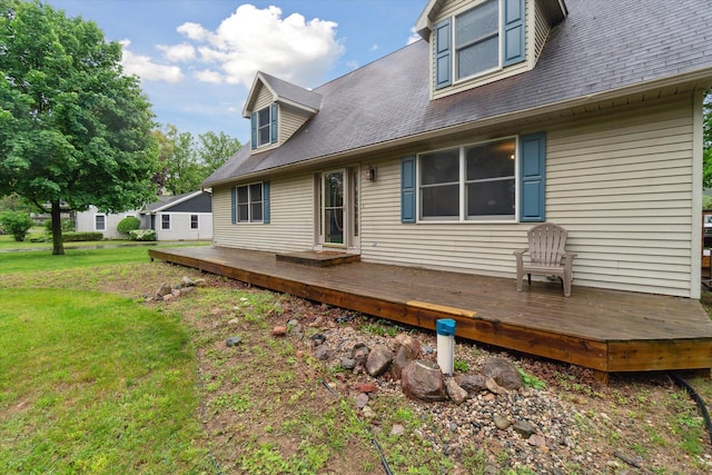 123 N F St, Trufant, MI 49347 - back of property with a wooden deck and a lawn