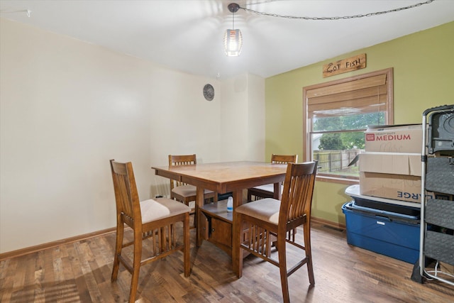 123 N F St, Trufant, MI 49347 - dining area featuring wood finished floors and baseboards