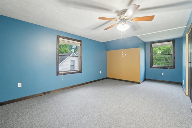 123 N F St, Trufant, MI 49347 - additional living space with light carpet, ceiling fan, baseboards, and vaulted ceiling