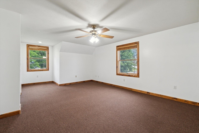 123 N F St, Trufant, MI 49347 - carpeted empty room featuring healthy amount of natural light, baseboards, and ceiling fan
