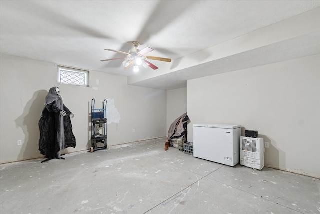 123 N F St, Trufant, MI 49347 - below grade area with white refrigerator and a ceiling fan