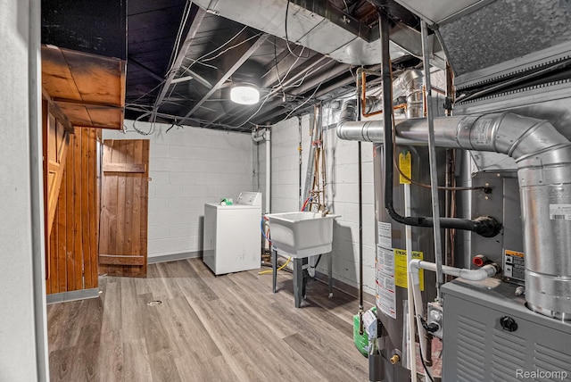 1860 Moran Ave, Lincoln Park, MI 48146 - unfinished below grade area featuring wood finished floors and washer and clothes dryer