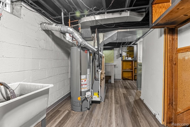 1860 Moran Ave, Lincoln Park, MI 48146 - unfinished basement featuring gas water heater, wood finished floors, and a sink