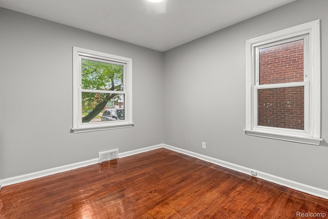 1860 Moran Ave, Lincoln Park, MI 48146 - empty room featuring baseboards and dark wood-style flooring