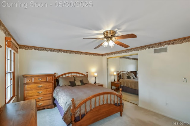 13936 Grove Park Dr, Sterling Heights, MI 48313 - bedroom with light colored carpet, a closet, and ceiling fan