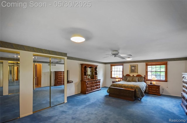13936 Grove Park Dr, Sterling Heights, MI 48313 - carpeted bedroom with multiple closets, baseboards, and a ceiling fan