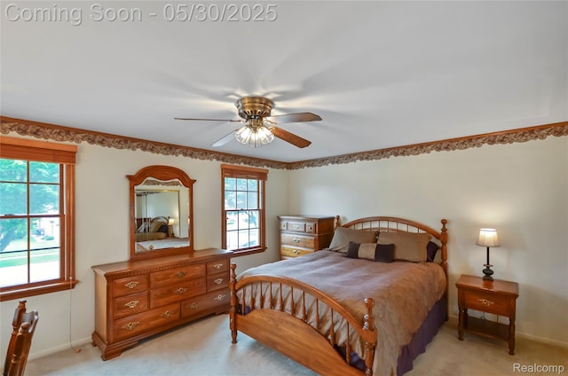 13936 Grove Park Dr, Sterling Heights, MI 48313 - bedroom with light carpet, baseboards, and ceiling fan