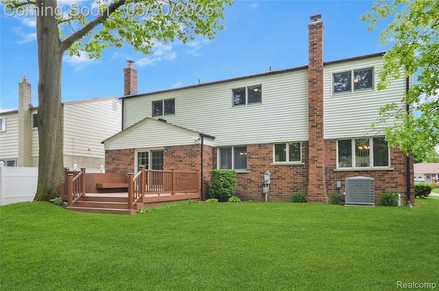 13936 Grove Park Dr, Sterling Heights, MI 48313 - back of house with central AC, a wooden deck, brick siding, and a chimney