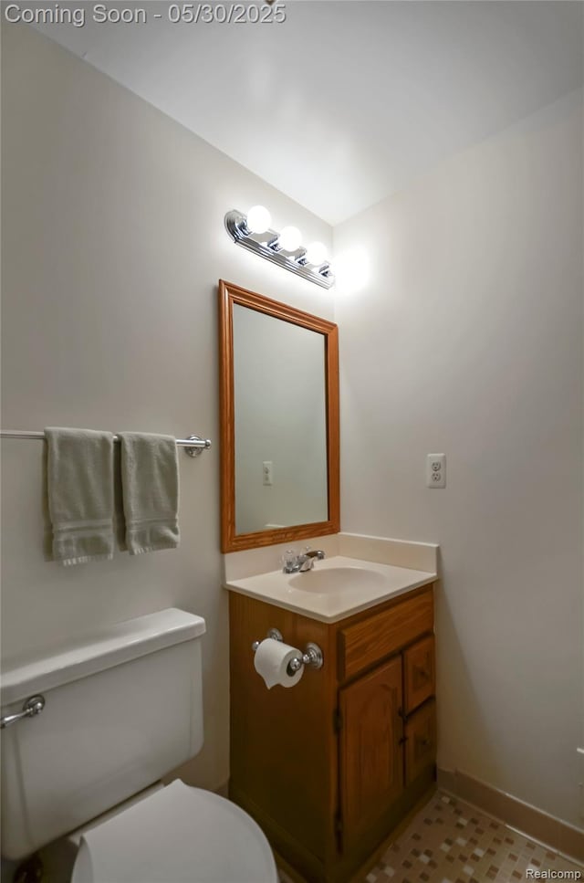 13936 Grove Park Dr, Sterling Heights, MI 48313 - bathroom featuring toilet, vanity, and baseboards