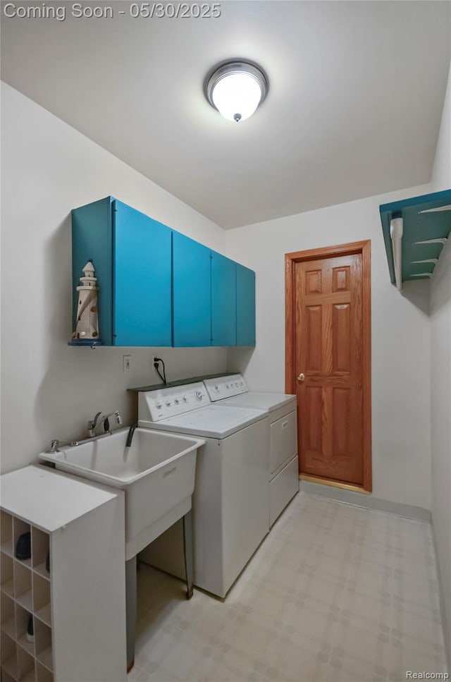 13936 Grove Park Dr, Sterling Heights, MI 48313 - laundry room with cabinet space, washer and dryer, light flooring, and baseboards