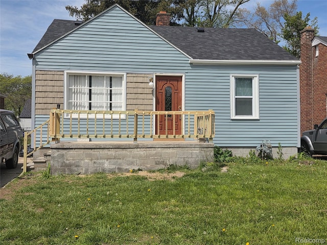 11717 Marlowe St, Detroit, MI 48227 - bungalow-style home featuring a shingled roof, a front lawn, a chimney, and a porch