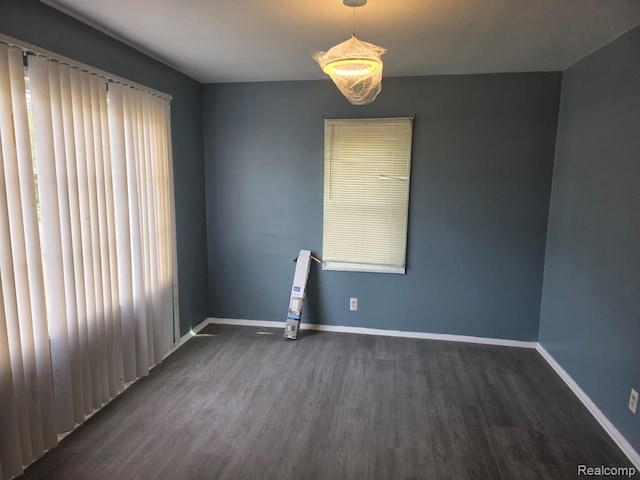 11717 Marlowe St, Detroit, MI 48227 - empty room with dark wood-style floors and baseboards