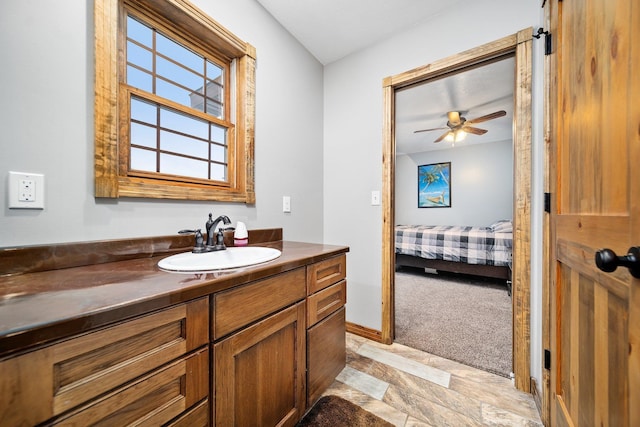 17582 Leroy Rd, Leroy, MI 49655 - ensuite bathroom with vanity, a ceiling fan, and baseboards