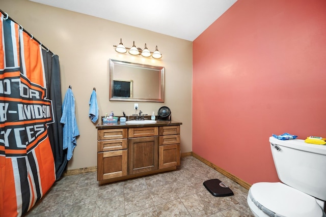17582 Leroy Rd, Leroy, MI 49655 - full bathroom with vanity, toilet, and baseboards
