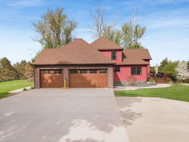 17582 Leroy Rd, Leroy, MI 49655 - view of front of house featuring a shingled roof, concrete driveway, a front lawn, a garage, and a deck