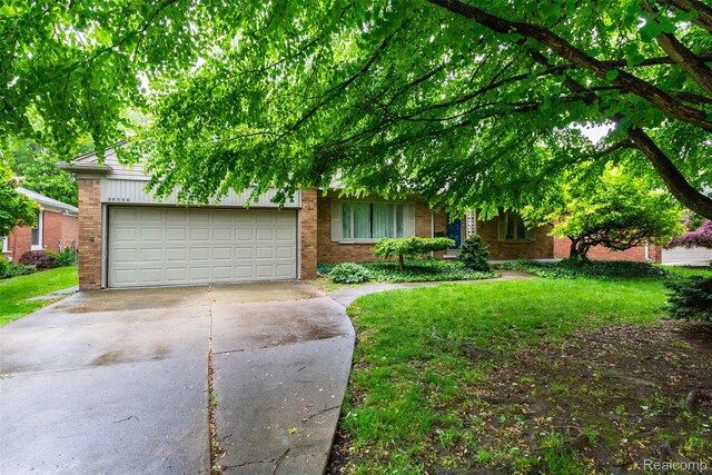 20550 Fairway Ln, Grosse Pointe Woods, MI 48236 - obstructed view of property with brick siding, concrete driveway, a garage, and a front lawn