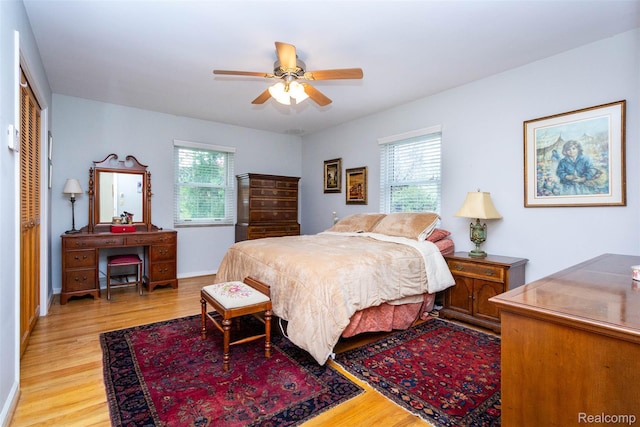 20550 Fairway Ln, Grosse Pointe Woods, MI 48236 - bedroom featuring light wood-type flooring, a closet, and a ceiling fan