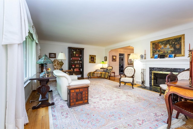 20550 Fairway Ln, Grosse Pointe Woods, MI 48236 - living room with a fireplace, wood finished floors, and baseboards