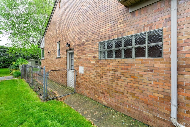 20550 Fairway Ln, Grosse Pointe Woods, MI 48236 - view of property exterior with a gate and brick siding