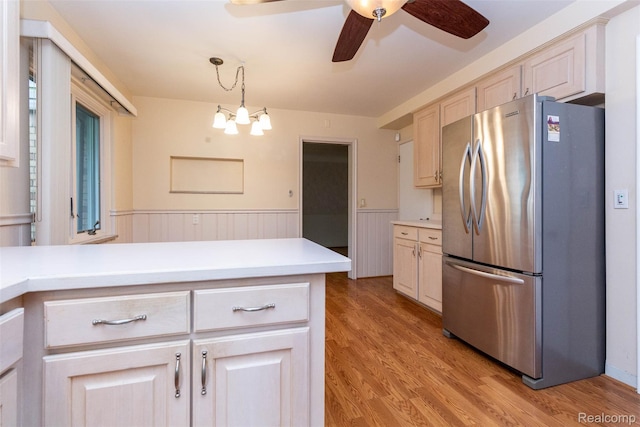 20550 Fairway Ln, Grosse Pointe Woods, MI 48236 - kitchen with freestanding refrigerator, wainscoting, ceiling fan, light countertops, and light wood-type flooring