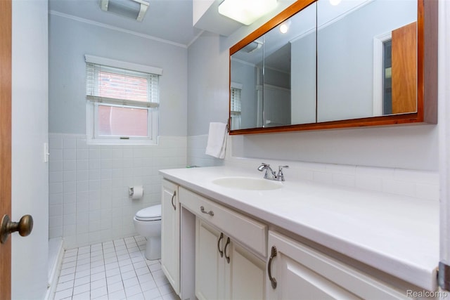20550 Fairway Ln, Grosse Pointe Woods, MI 48236 - bathroom with tile patterned flooring, toilet, vanity, tile walls, and a wainscoted wall