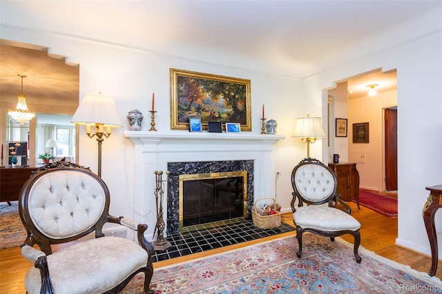 20550 Fairway Ln, Grosse Pointe Woods, MI 48236 - living area with wood finished floors, a premium fireplace, and baseboards