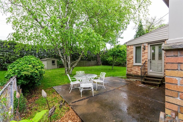 20550 Fairway Ln, Grosse Pointe Woods, MI 48236 - view of patio / terrace featuring entry steps, an outbuilding, and outdoor dining space