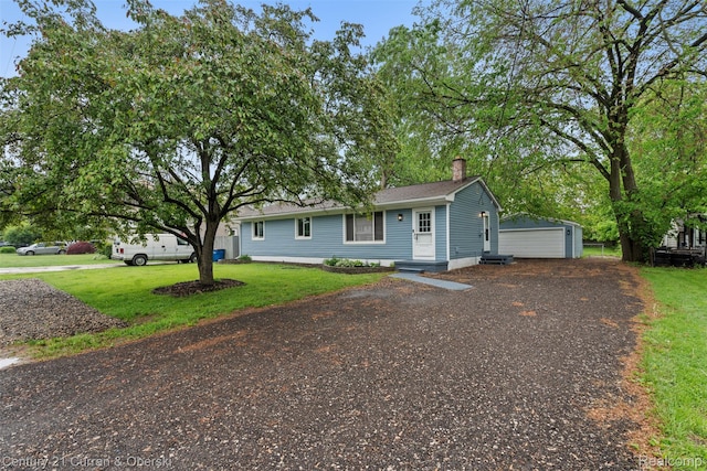 6262 Garden Ct, Warren, MI 48091 - view of front of home featuring a chimney, an outdoor structure, a front yard, and a detached garage