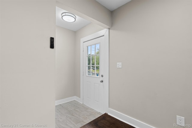 6262 Garden Ct, Warren, MI 48091 - doorway with baseboards and light marble finish flooring