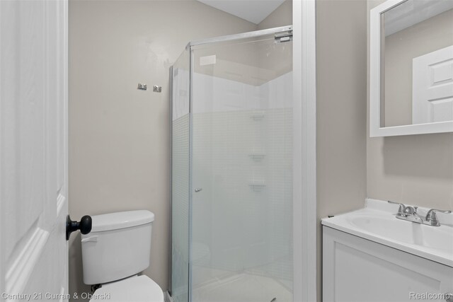 6262 Garden Ct, Warren, MI 48091 - bathroom featuring toilet, vanity, and a stall shower